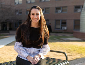 Smiling student on bench